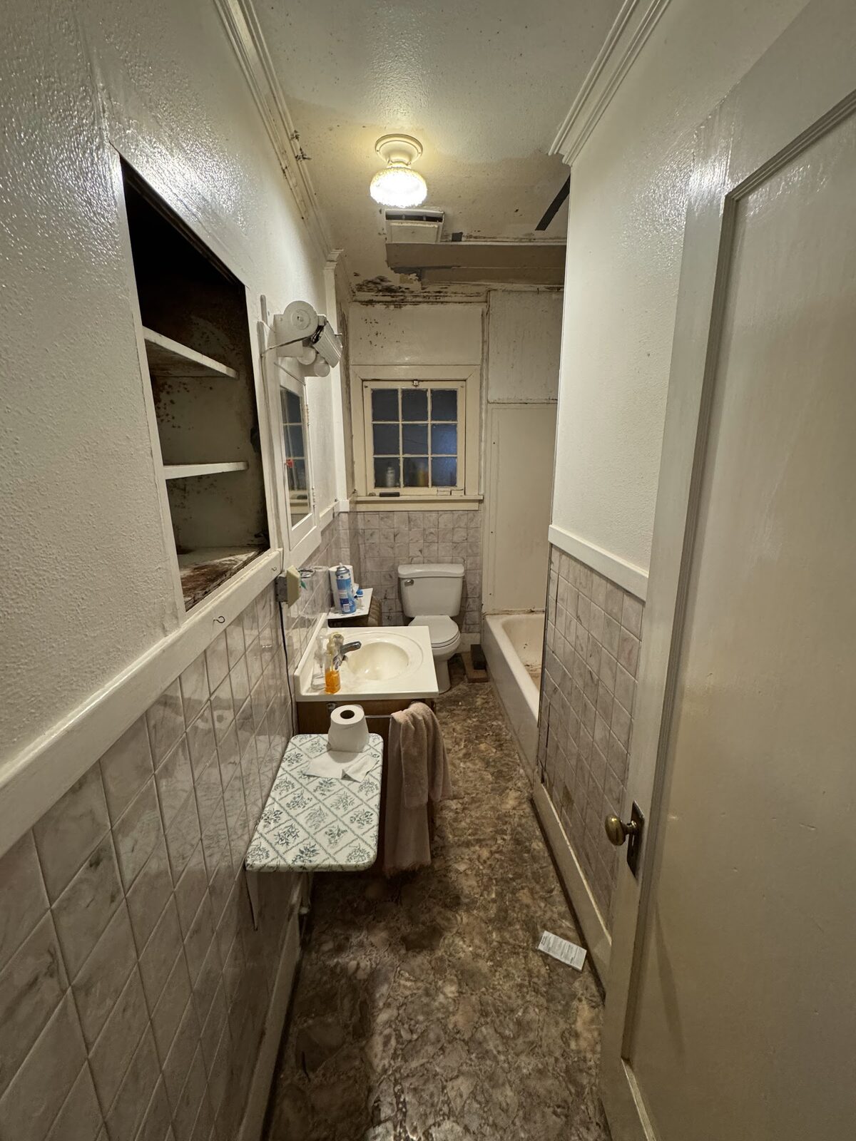 6972 Oak St before rehab, bathroom