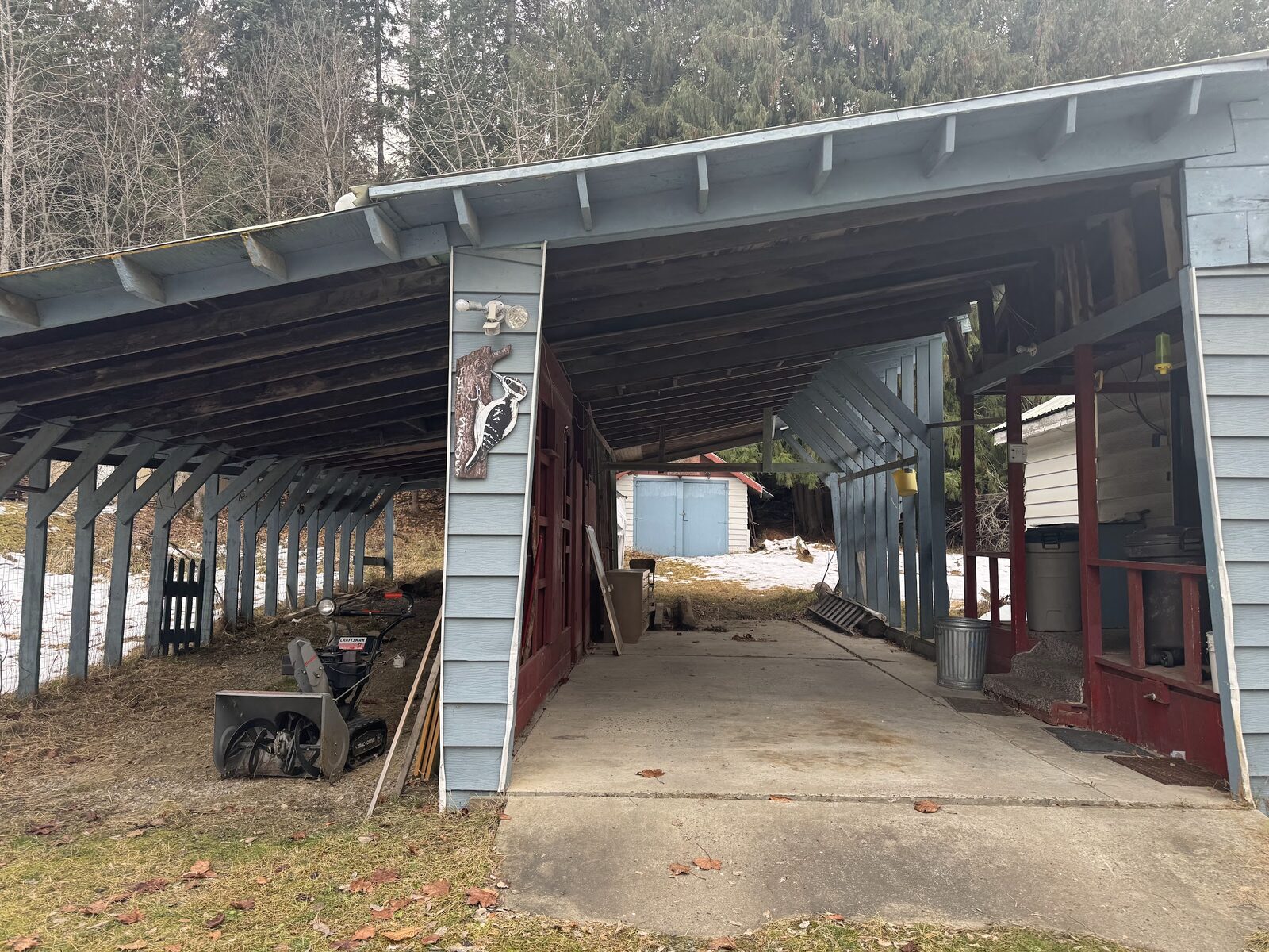 6972 Oak St before rehab, carport