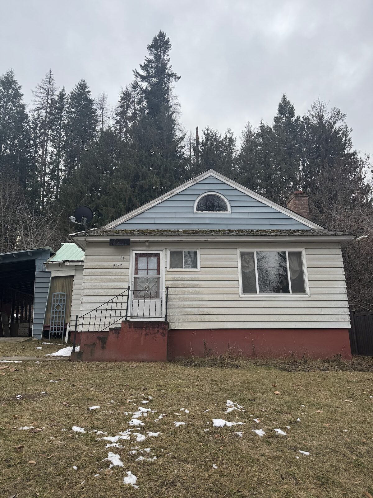 6972 Oak St before rehab, front exterior