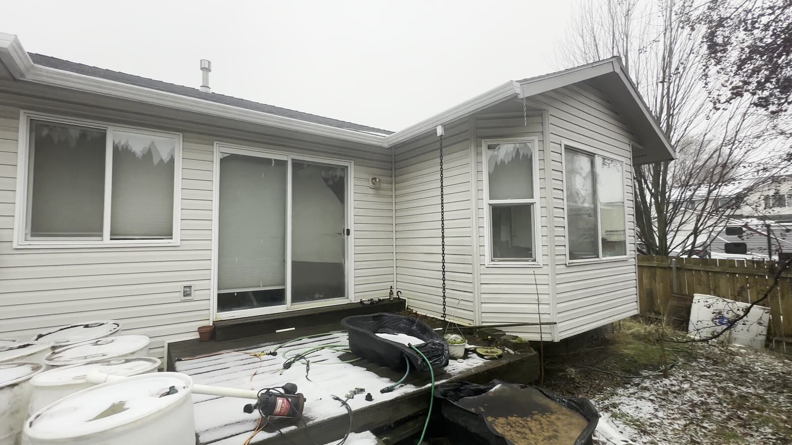 521 N Stephanie St before rehab, rear exterior